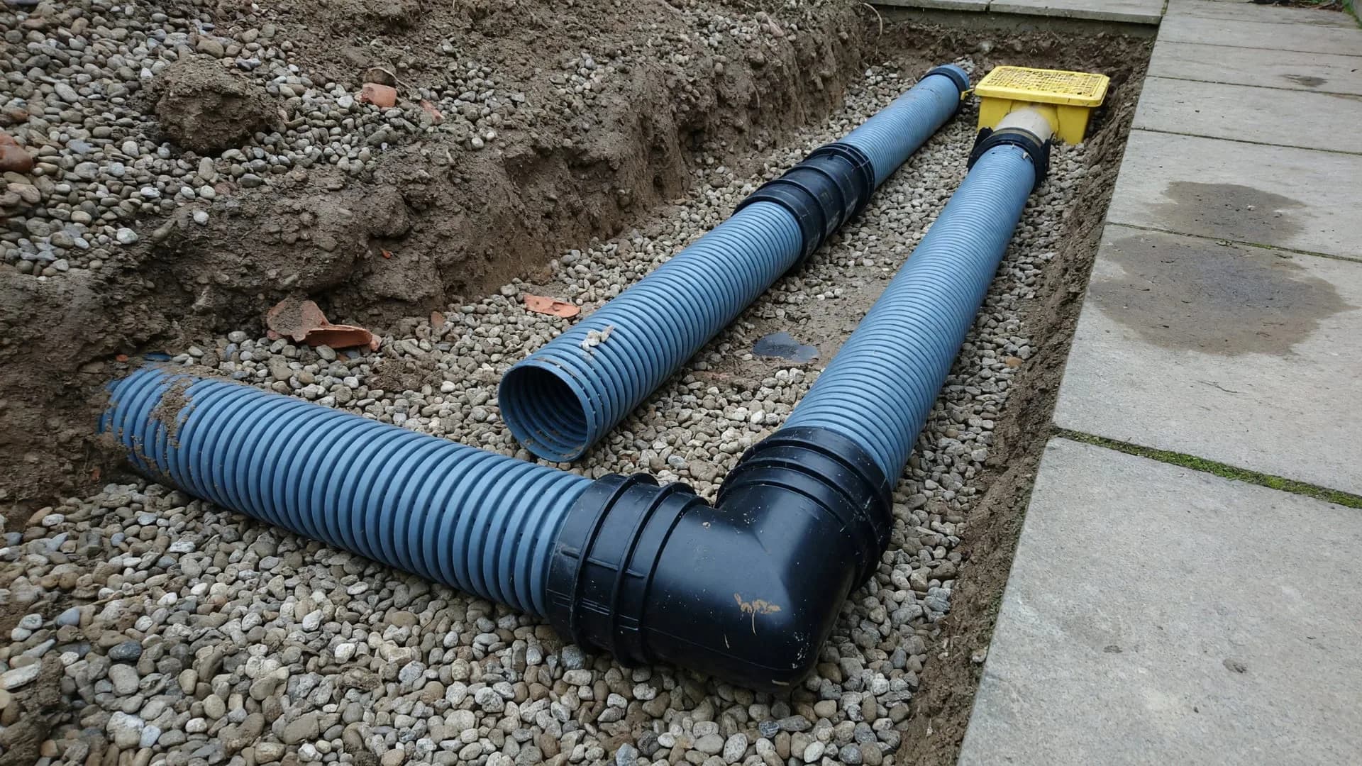 Land drain elbows — turning corners without kinking the pipe